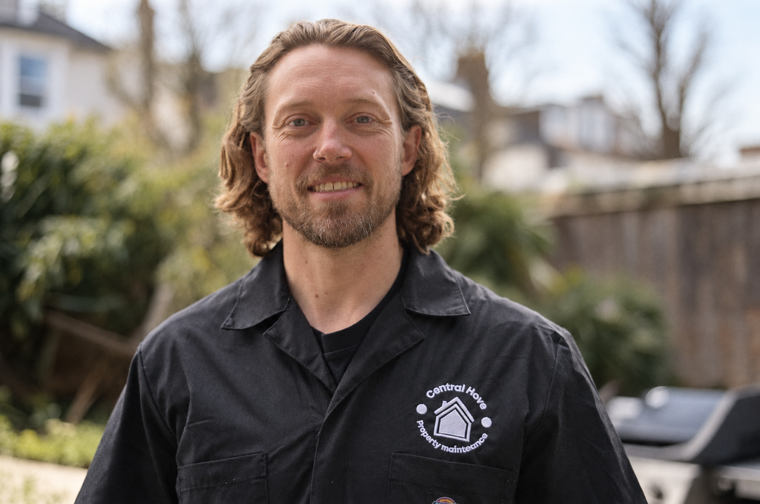 Brendan Cross, owner of Central Hove Decorators, wearing company workwear